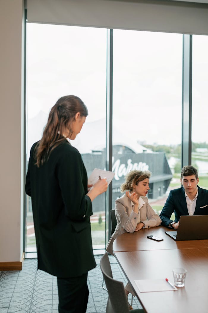 creative Teamwork in action as business professionals collaborate on a project in a modern office setting.